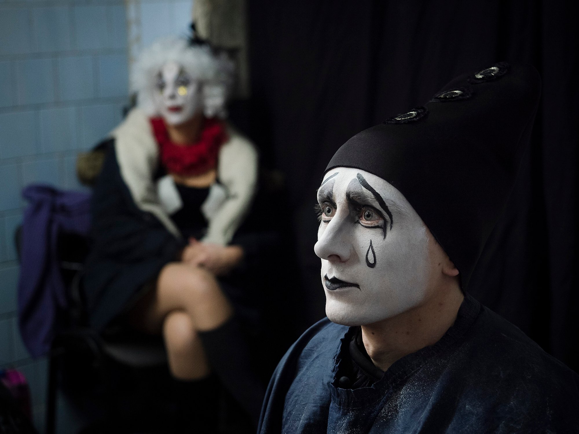 Backstage at the National Oleksandr Dovzhenko Film Centre, actors Dmytro Olyinkyk and Khrysina Synelnik are preparing for the premiere of 'Numbers,' directed remotely by imprisoned filmmaker Oleh Sentsov.