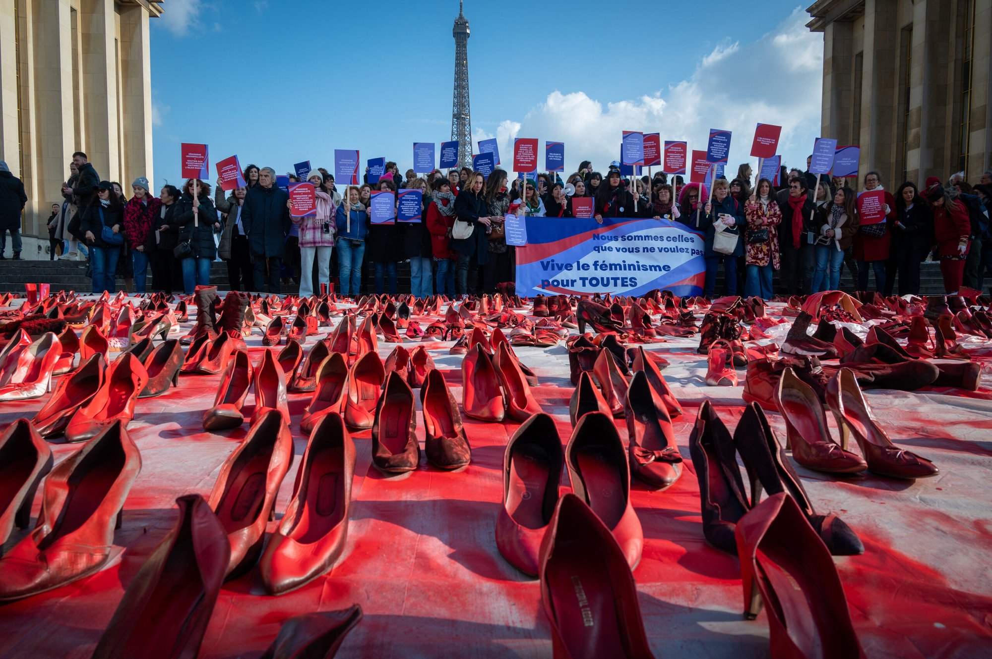 Tens of pairs of shoes covered in red paint is art installation that symbolizes all the victims of femicides.