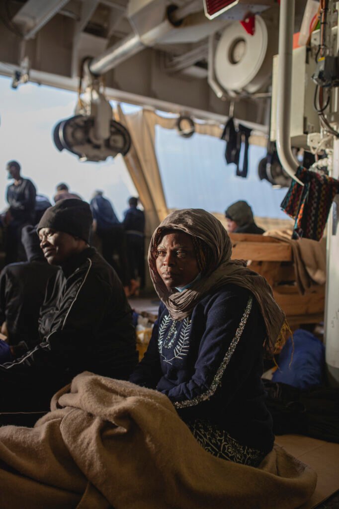 In Salerno, Italy, a Cameroonian woman waits disembarkation on Geo Barents, the Doctors Without Borders (MSF) humanitarian ship.