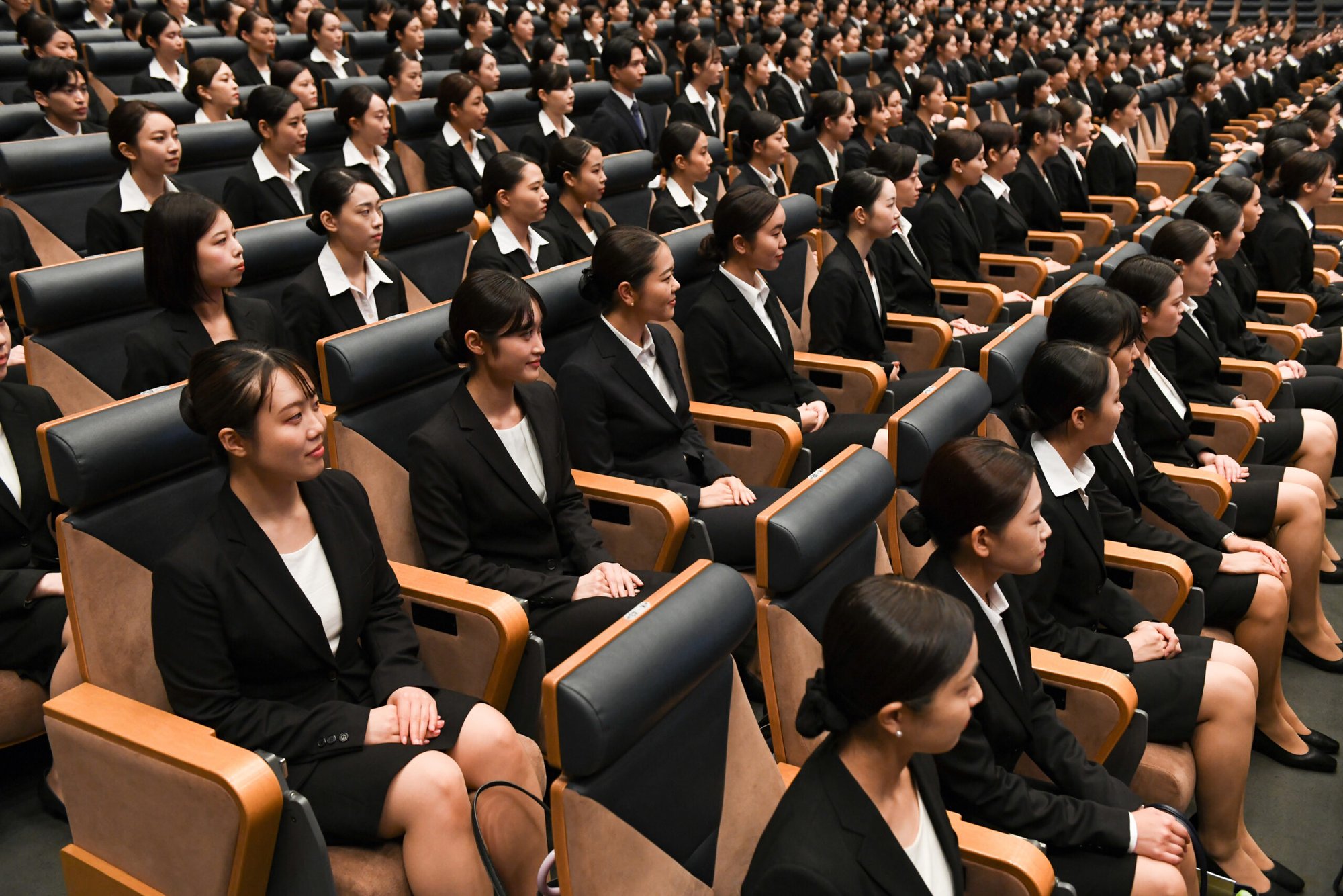 Newly hired flight attendants of All Nippon Airways (ANA) gather for their induction ceremony in Tokyo.         
