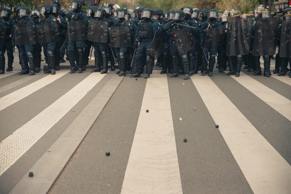 A line of police advances towards the protesters in Paris May 1 demonstration.