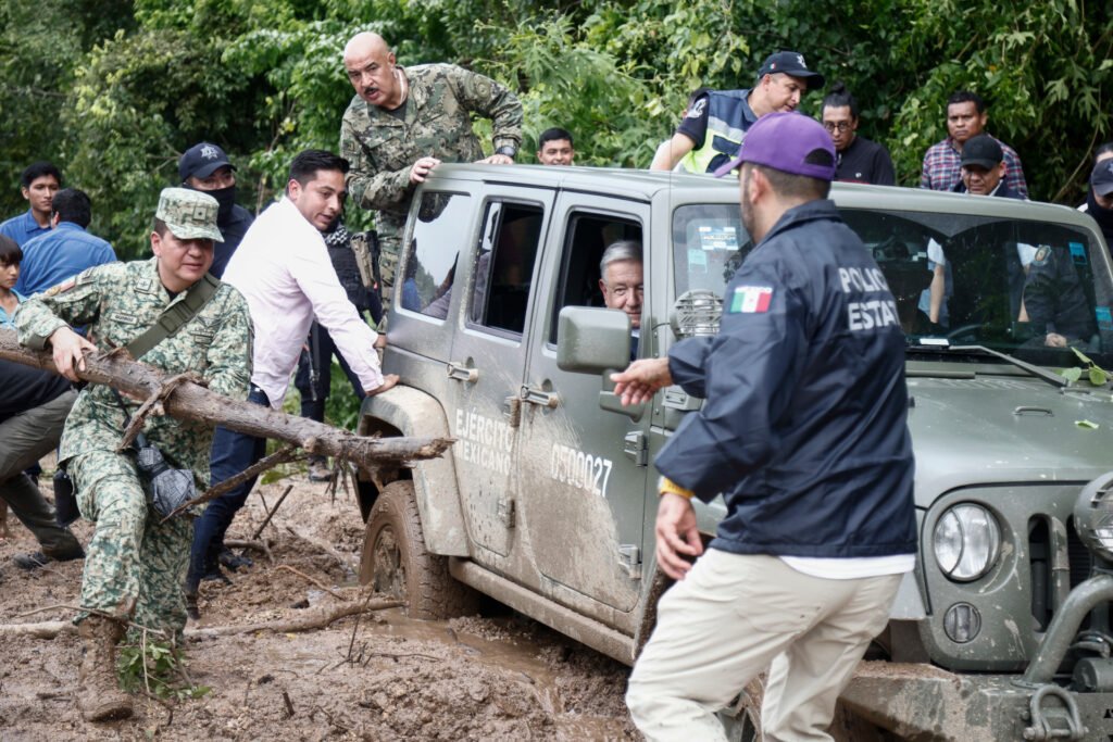 Mexican President Andres Manuel Lopez Obrador's vehicle got stuck in mud during a visit to the Kilometro 42 community near Acapulco, Guerrero State, Mexico, in the aftermath of Hurricane Otis.