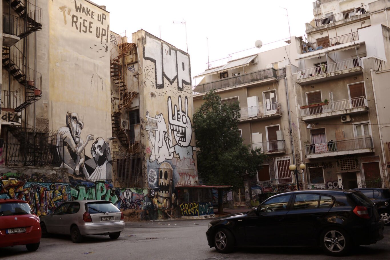 "Wake Up Rise Up" slogans on the walls of buildings in Exarcheia.