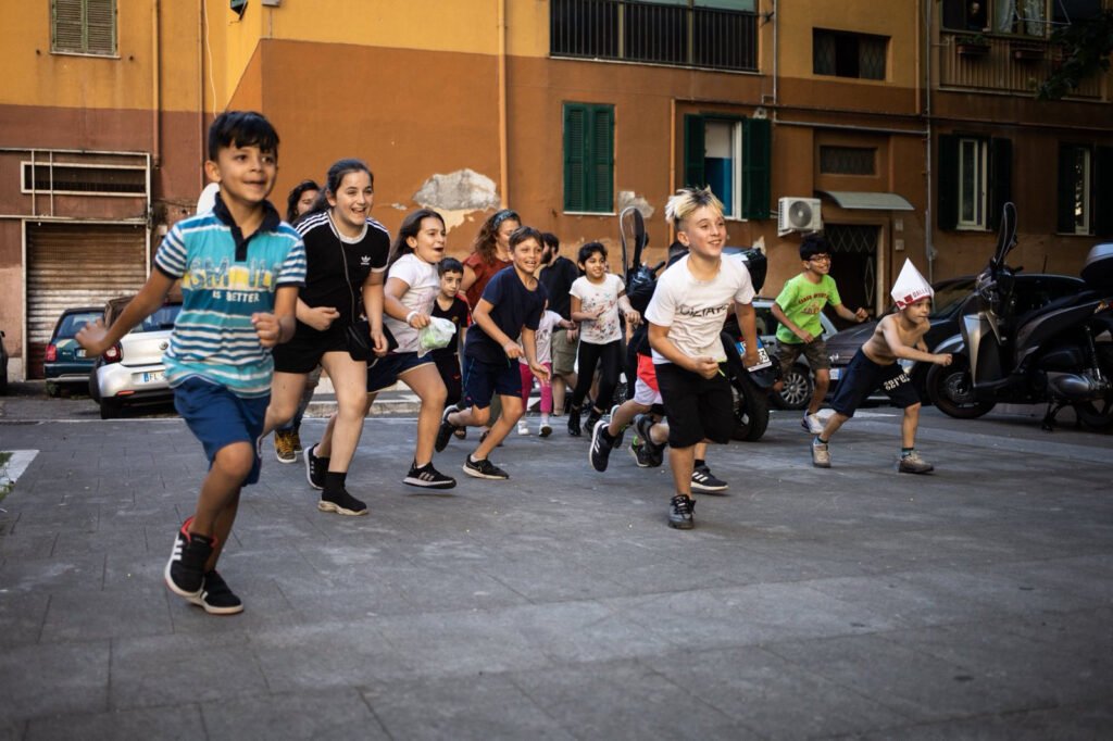 Children playing at the afterschool program in the Quarticciolo neighborhood of Rome, Italy.