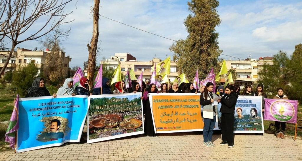 Women's Ecology Platform announces a new campaign to plant trees with banners showing slogans, martyrs, and a picture of Abdullah Öcalan.