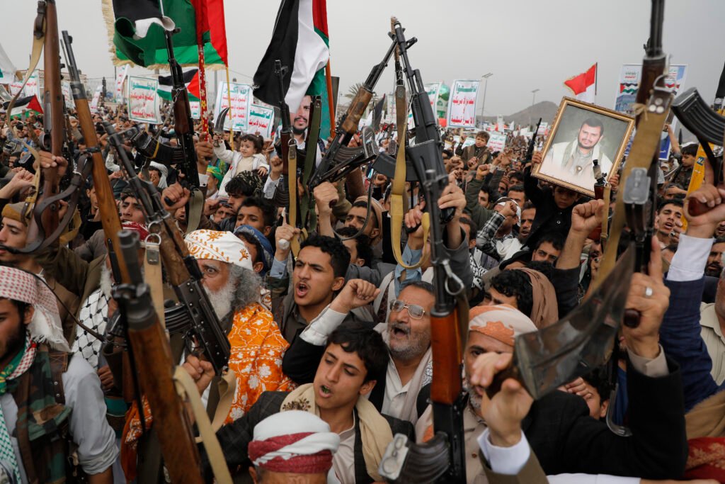 Yemenis loyal to the Houthi group demonstrate with kalashnikovs on the streets in Sana'a in solidarity with the Palestinian people.