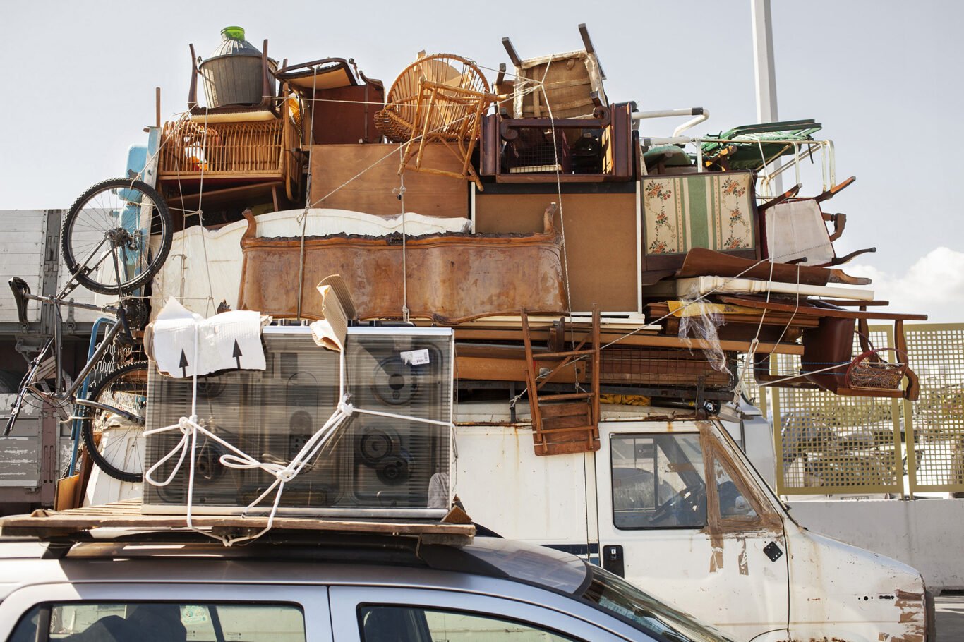 Tunisian immigrant merchants pack their car in Palermo port Italy.