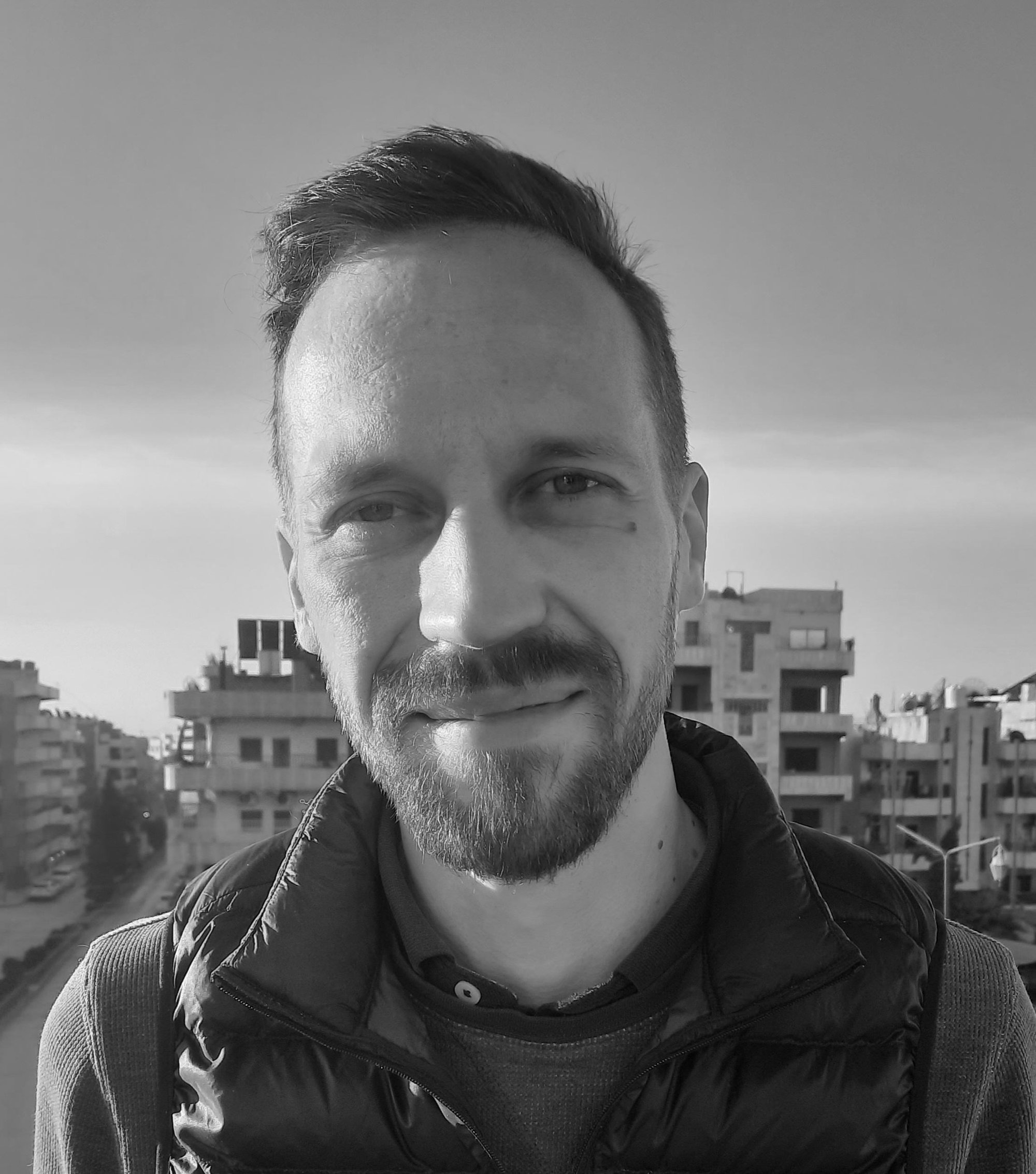 Henri Sulku journalist author portrait.