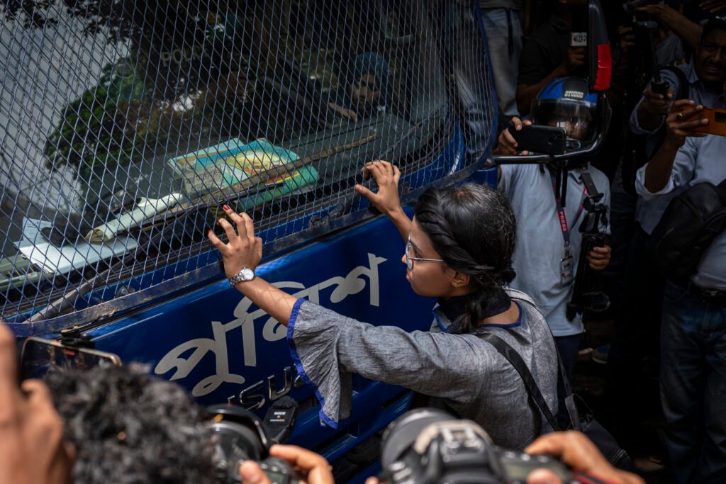 In Dhaka, Bangladesh, protesters are blocking a police van during a demonstration in front of the High Court building.