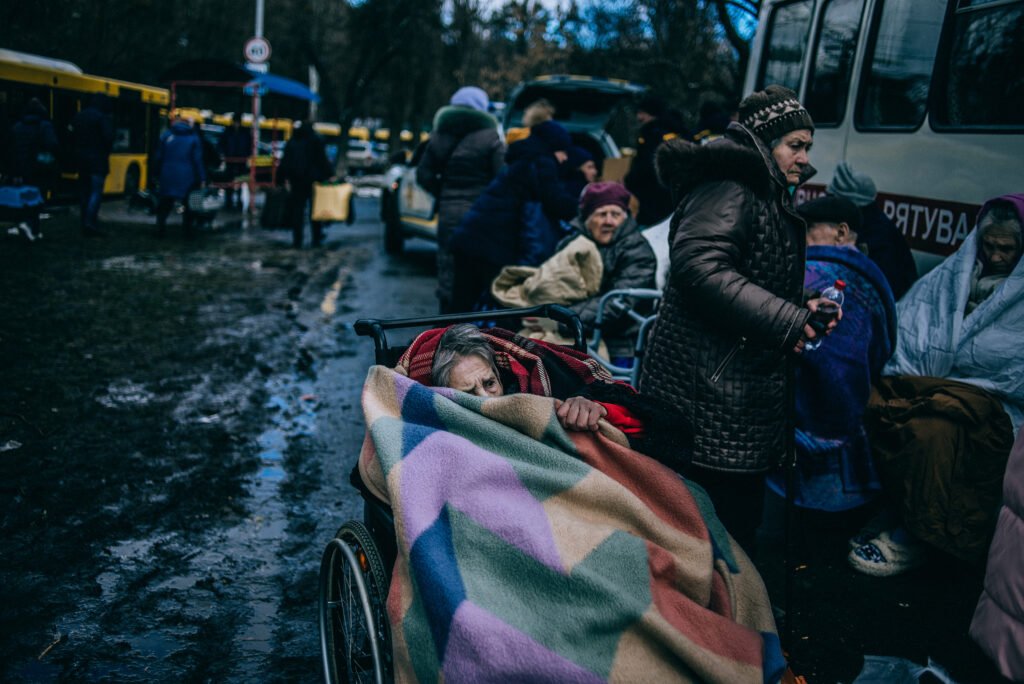 An elderly woman hides under a blanket as she is evacuated from Irpin, Ukraine on March, 8 2022.