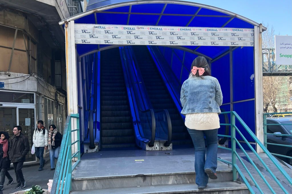 Woman defying mandatory hijab in downtown Tehran, Iran.