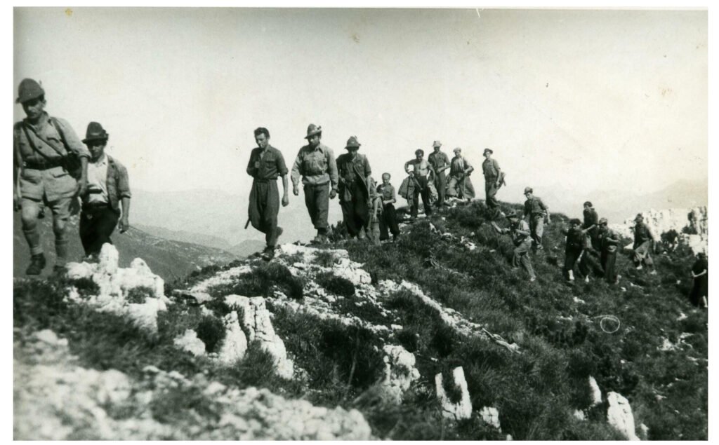 Catholic Partisans of the Fiamme Verdi (Green Flames) crossing a mountain pass in Eastern Lombardian Alps.