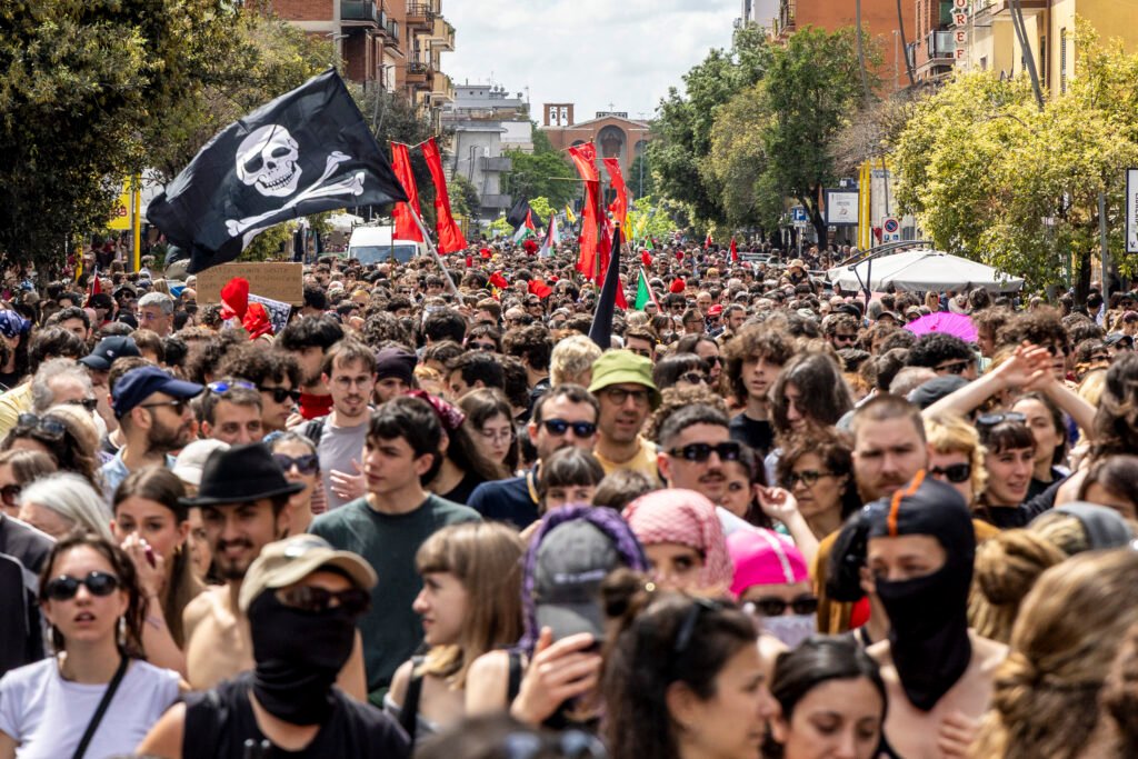 Thousands march down Via dei Castani in Centocelle, Rome, on April 25 to mark Liberation Day.