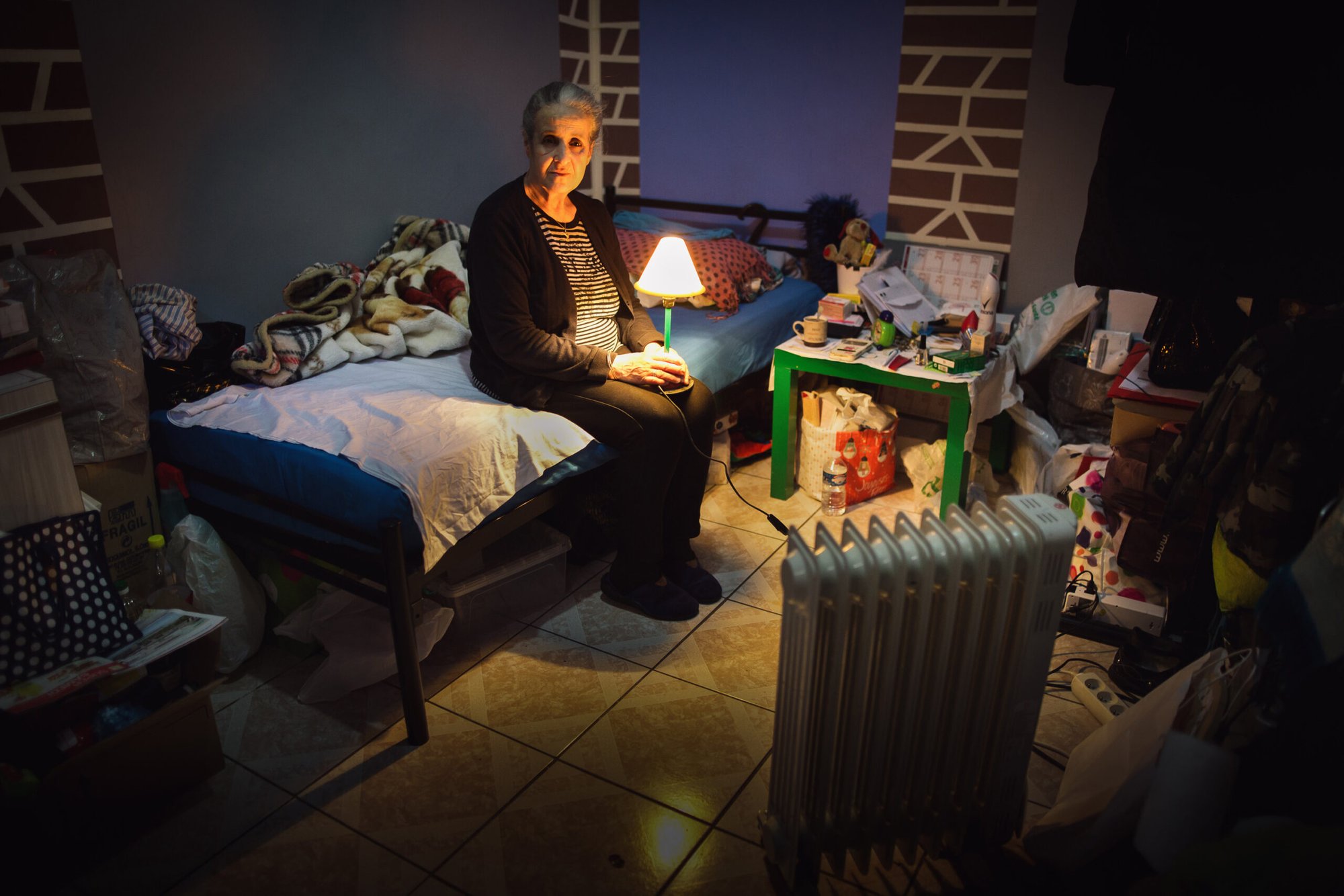 Baya, 68, in the 8m2 hotel room she has occupied since being evicted a year and a half ago.