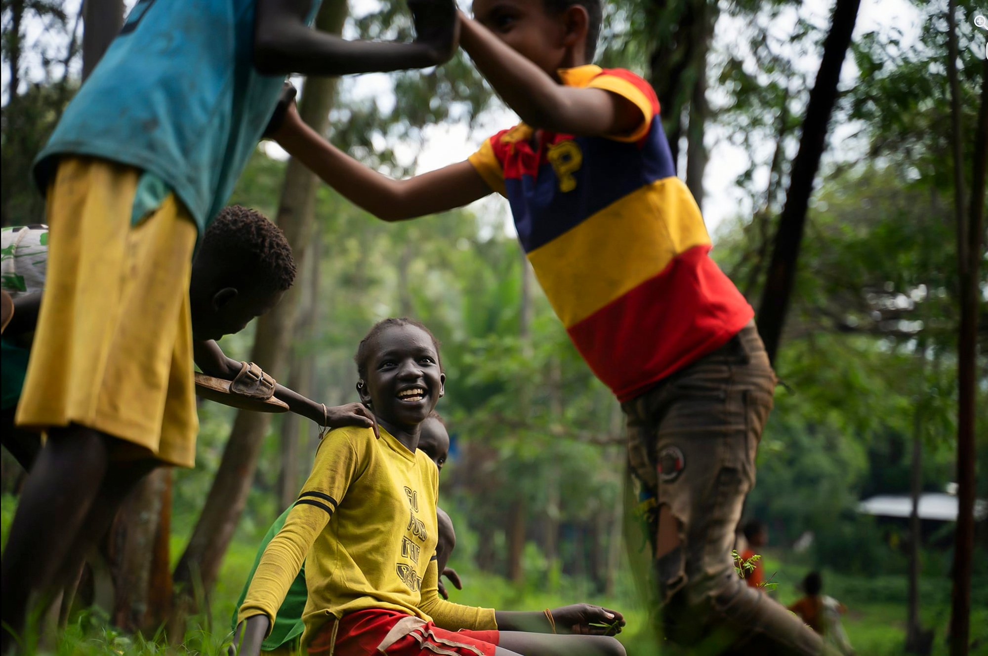 Children playing among trees in Asosa, Ethiopia.