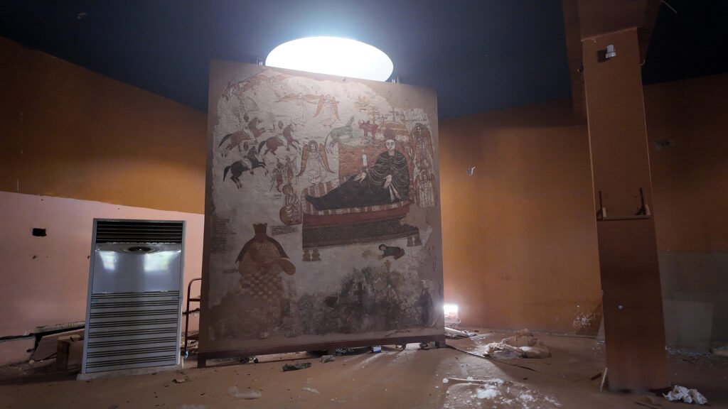 The RSF, which occupied the Sudan National Museum, looted collections and left shattered galleries around the outdoor ram statue and a scarred medieval Nubian fresco inside,